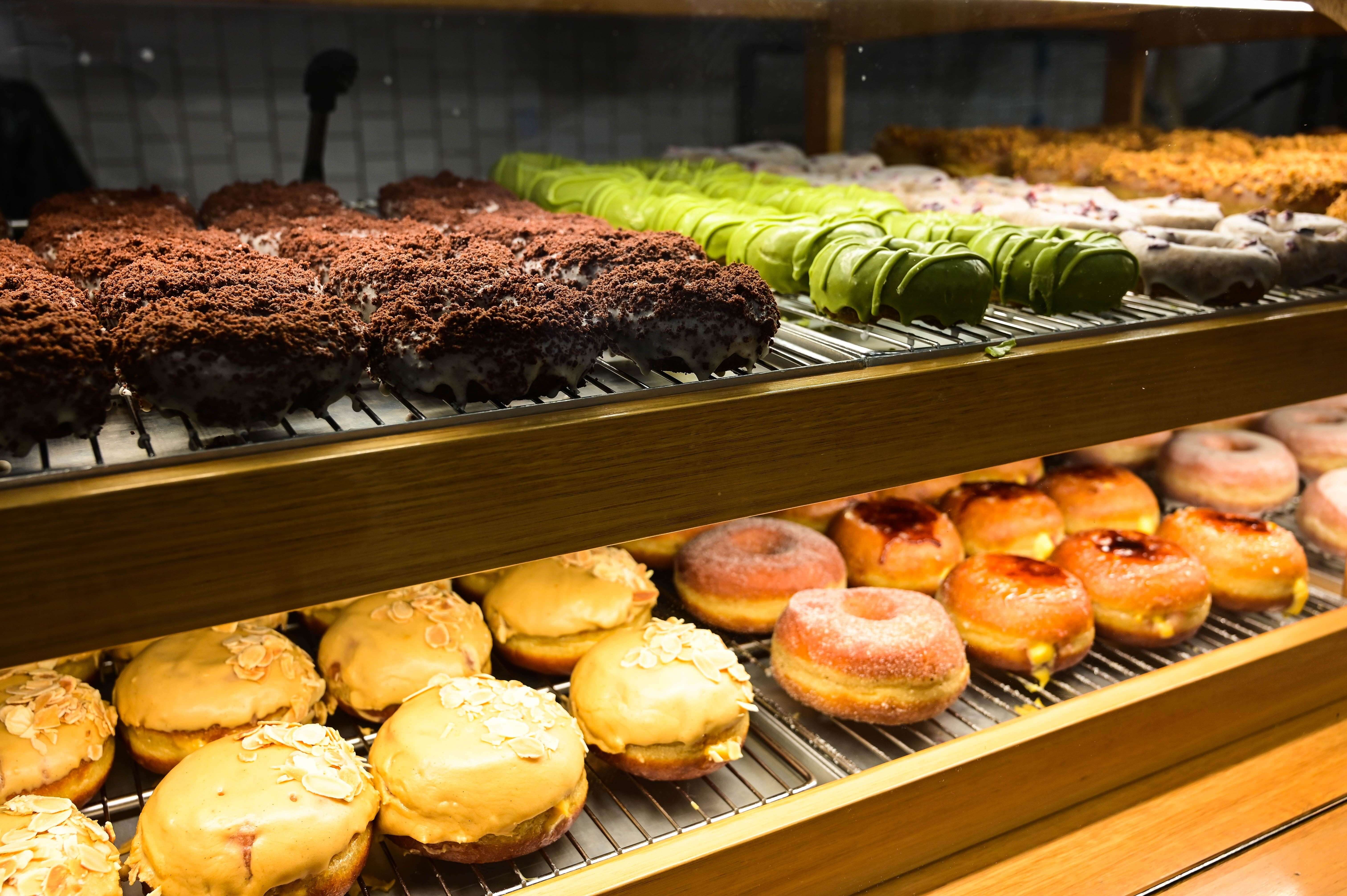 Donuts of various flavors in the window. Melbourne, Australia.